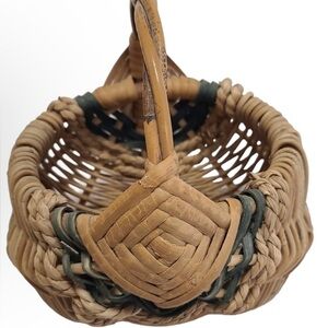 Vintage hand crafted woven basket signed by artist.